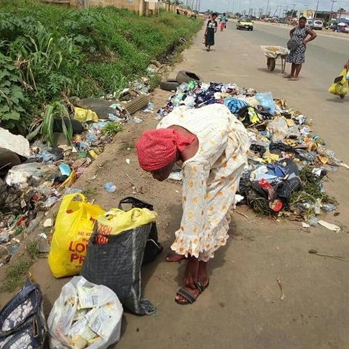 Lady Spotted Collecting Used Sanitary Pads, Pampers In Owerri, Imo State (Photos)