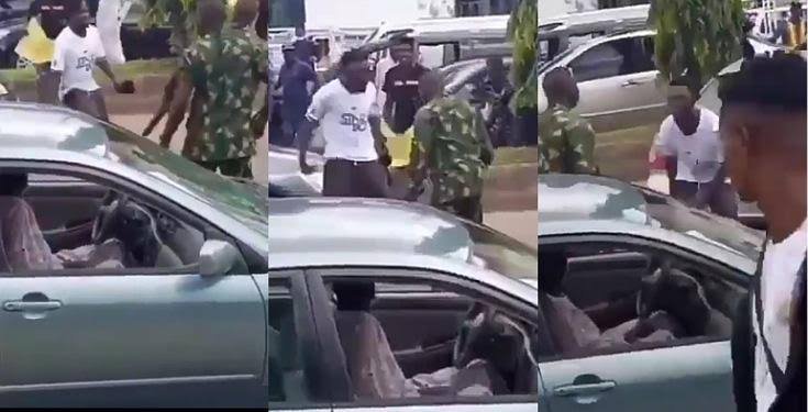 #EndSARS: Fearless Protester Refuses To Back Down Despite Being Flogged By Military Men (VIDEO)