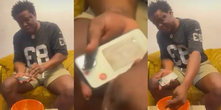 “My Phone No Go Kill Me” – Man Causes Stir Online As He Cools iPhone 12 Pro Max Overheating Problem with Cold Water