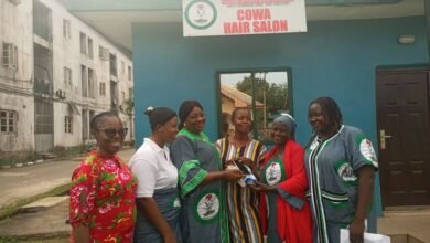 Jemima Emmanuel Widow 4th (L) receiving the Android phone today at customs Barracks Ebubu Eleme Rivers state